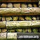 Wie man eine Stützmauer aus Landschaftsbauholz baut